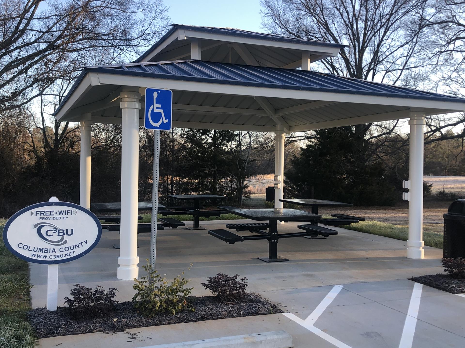 Picnic Tables next to Sign